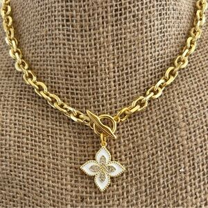 Gold Chain Necklace with White Floral Pendant.
